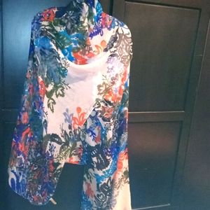 Giant floral woman scarf with glittered edges.